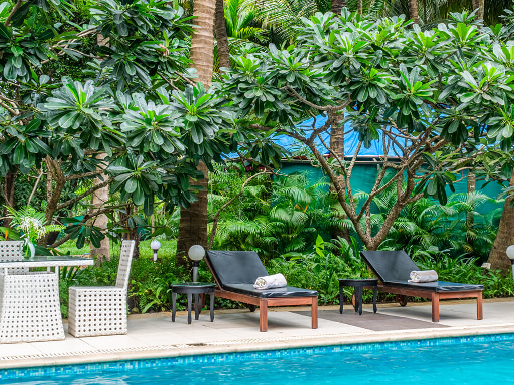 Panoramic view of the best villas in Alibaug featuring classic architecture and tropical greenery.