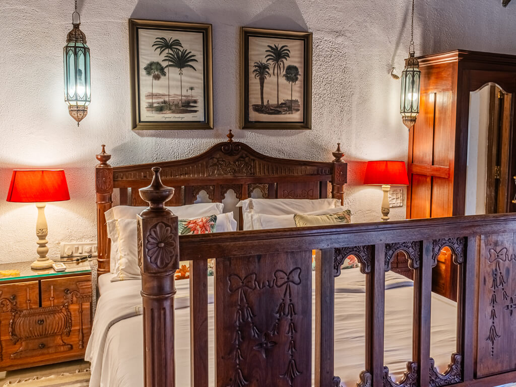 Heritage-style bedroom at Mango Villa, luxury villas in Alibaug on rent