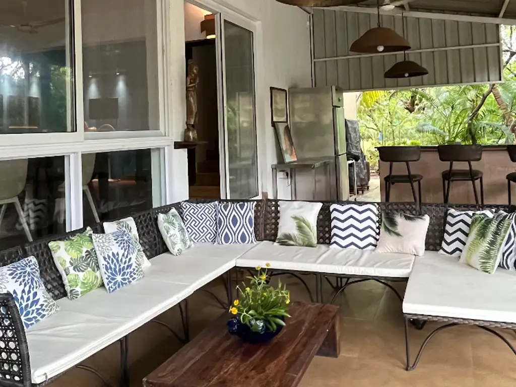 Open-air lobby seating at Mango Beach House Awas, Alibaug