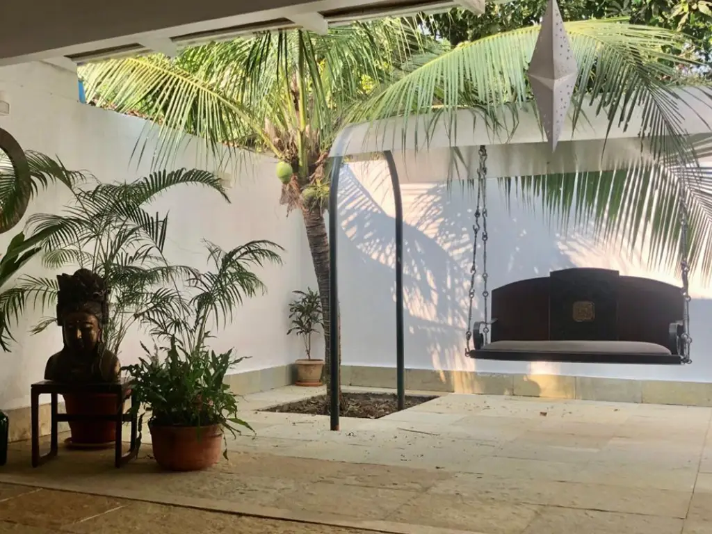 Peaceful outdoor seating space at Casa Mango villa in Alibaug